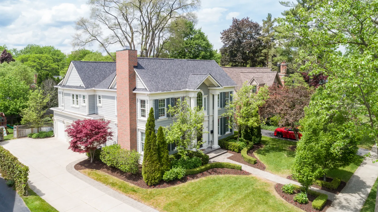 Aerial drone side photo of a large mansion-like home