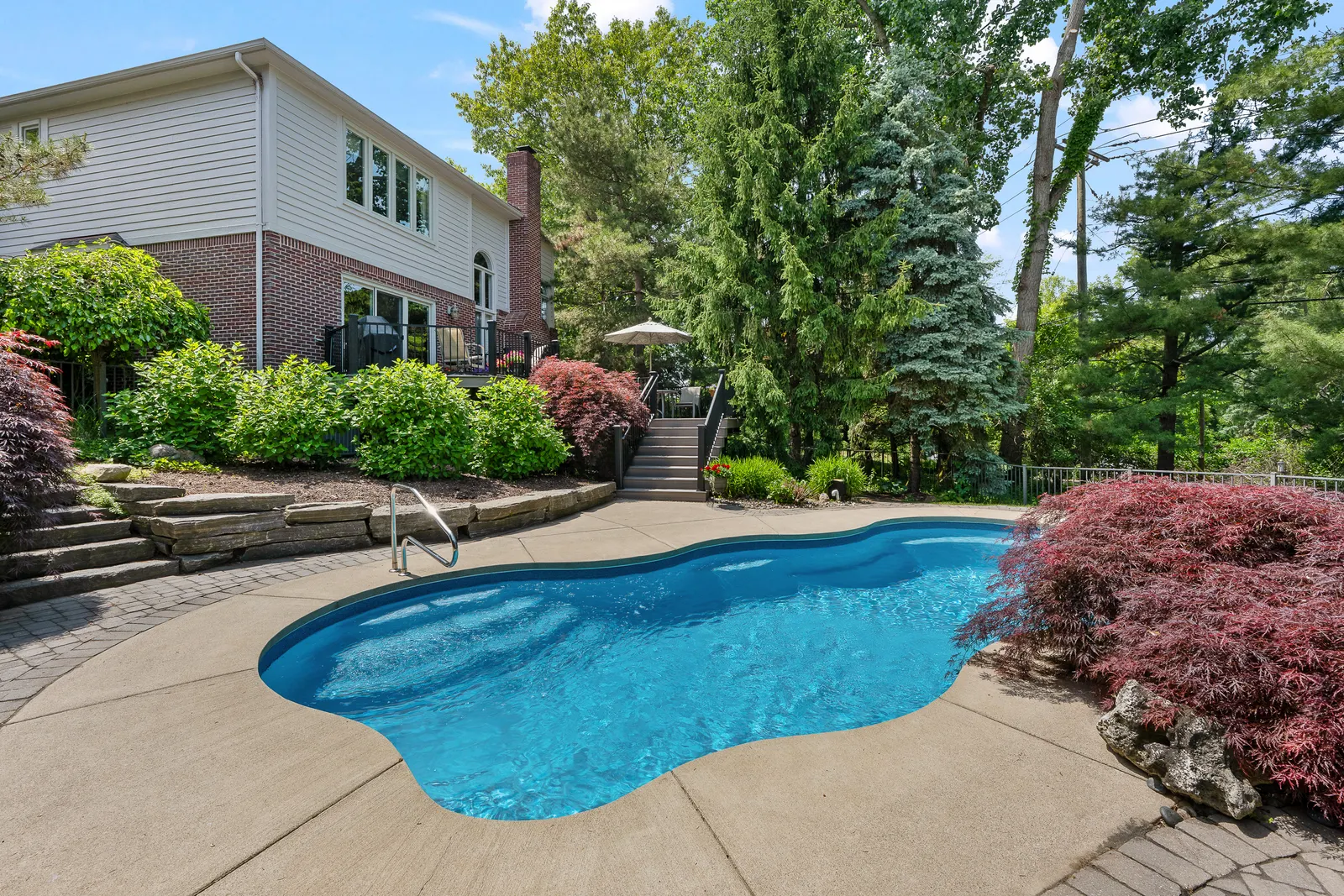 Ground-level photo of a backyard pool
