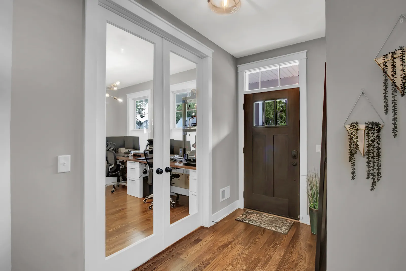 Interior photo of a front door and office room